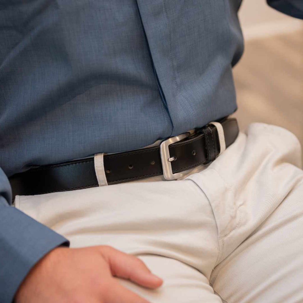 Black leather belt with black single side stitching and silver hypoallergenic buckle