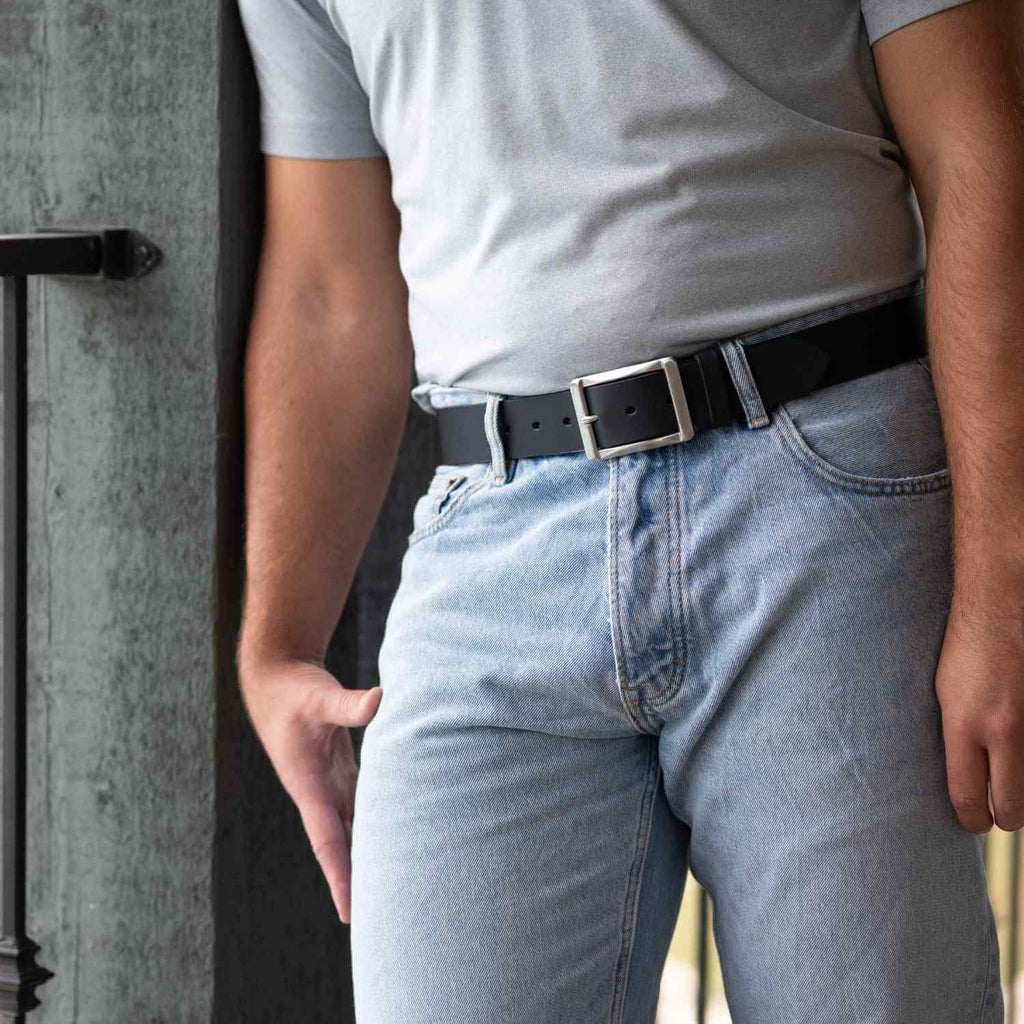 Site Manager Black Leather Belt on model wearing blue jeans and t-shirt. Stainless Steel buckle