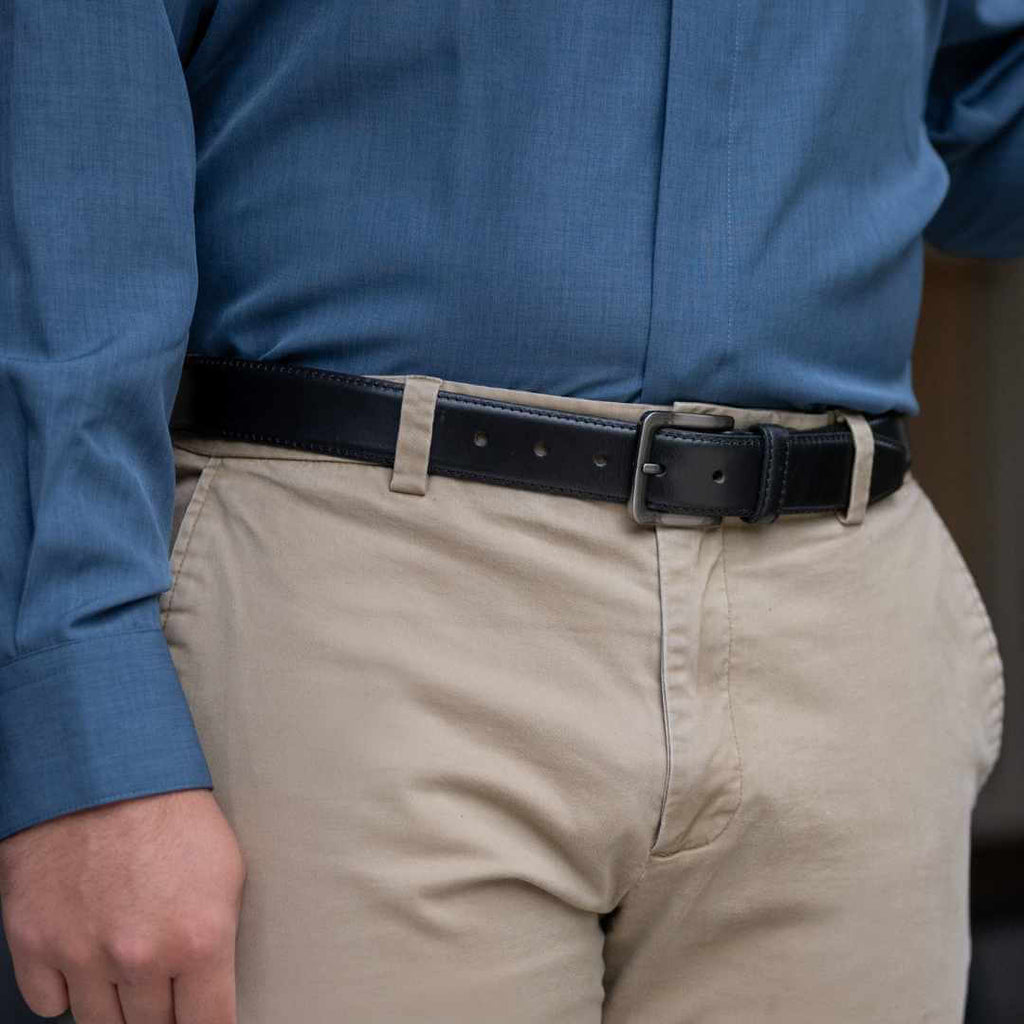 Image of Metro Black Leather Belt on model wearing blue shirt and khaki pants. Hypoallergenic