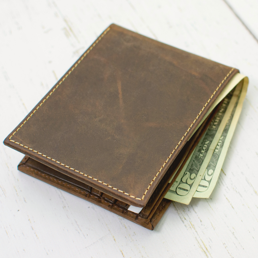 Randolph Bifold Distressed Leather Wallet. Two built-in cash pockets for paper currency.