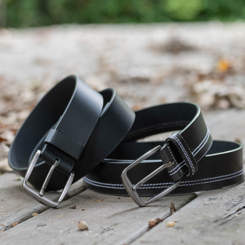 Millennial Black and Black Stitched Leather Belt Set. Outside settings. Black straps, silver buckles