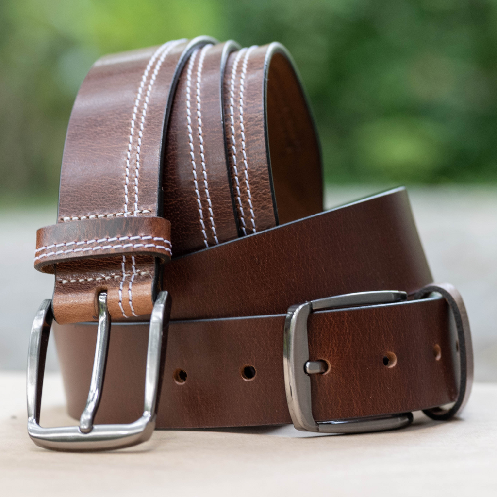 Millennial Brown and Brown Stitched Leather Belt Set. Outside setting. Glossy brown leather straps.