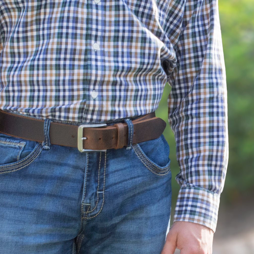 Mt. Pisgah Titanium Distressed Leather Brown Belt by Nickel Smart® on a model in jeans